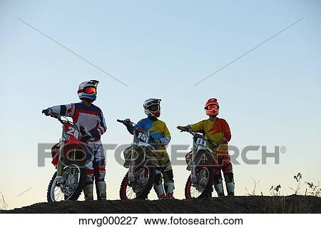 Motocross bikers on dirt track View Large Photo Image Stock Photo - Motocross bikers on dirt track. Fotosearch