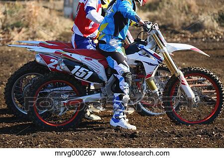Motocross bikers on dirt track View Large Photo Image Stock Photo - Motocross bikers on dirt track. Fotosearch