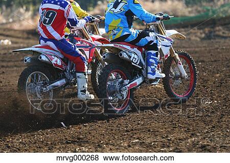 Motocross bikers on dirt track View Large Photo Image Stock Photo - Motocross bikers on dirt track. Fotosearch
