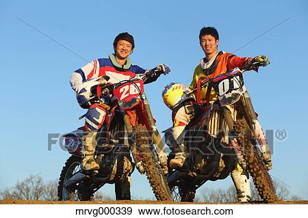 Motocross bikers on dirt track View Large Photo Image Stock Photo - Motocross bikers on dirt track. Fotosearch