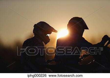Motocross bikers on dirt track View Large Photo Image Stock Photograph - Motocross bikers on dirt track. Fotosearch