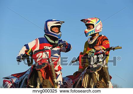Motocross bikers on dirt track View Large Photo Image Stock Photography - Motocross bikers on dirt track. Fotosearch