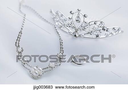 Stock Image - Necklace tiara and wedding ring. Fotosearch