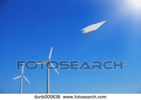 Paper plane flying and wind turbines View Large Photo Image Stock Photo - Paper plane flying and wind turbines. Fotosearch