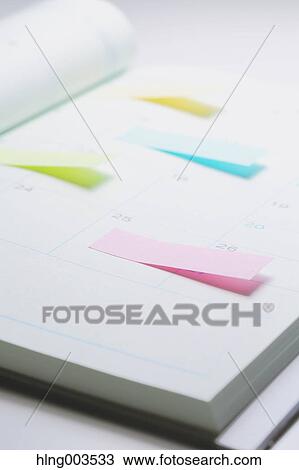 Stock Image - Post-it notes on a notebook. Fotosearch