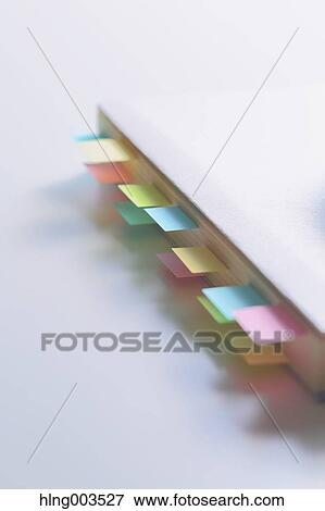 Post-it notes on a notebook View Large Photo Image Stock Photo - Post-it notes on a notebook. Fotosearch