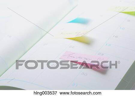 Stock Photo - Post-it notes on a notebook. Fotosearch