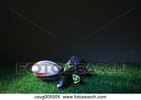 Stock Photography - Rugby equipment on grass. Fotosearch