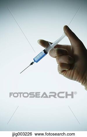 Stock Photograph - Scientist working in the lab. Fotosearch