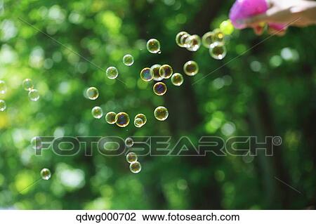 Soap bubbles and grass View Large Photo Image Stock Image - Soap bubbles and grass. Fotosearch