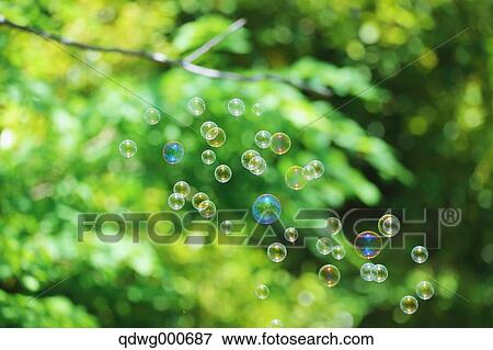 Soap bubbles and grass View Large Photo Image Stock Photo - Soap bubbles and grass. Fotosearch