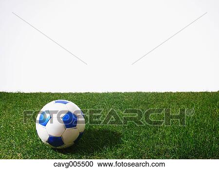 Stock Image - Soccer ball on grass. Fotosearch