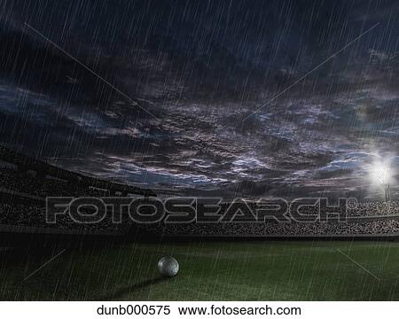 Soccer ball on the field on a rainy night View Large Photo Image Stock Photography - Soccer ball on the field on a rainy night. Fotosearch
