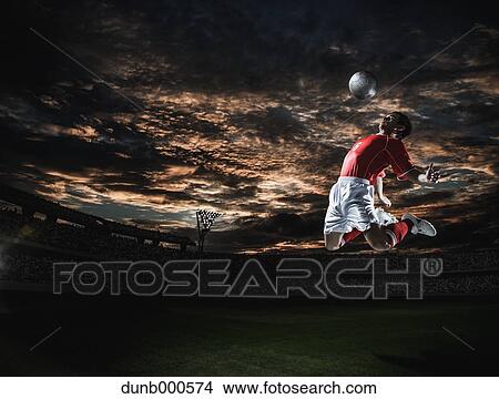 Picture - Soccer player in dramatic action. Fotosearch