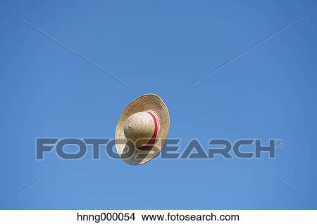 Straw hat flying in the sky View Large Photo Image Picture - Straw hat flying in the sky. Fotosearch