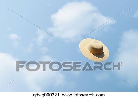 Straw hat flying in the sky View Large Photo Image Stock Image - Straw hat flying in the sky. Fotosearch