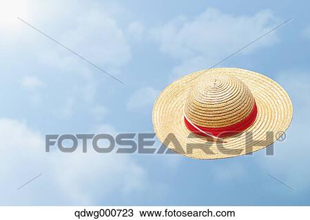 Straw hat flying in the sky View Large Photo Image Stock Image - Straw hat flying in the sky. Fotosearch
