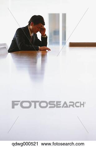 Stock Image - Tired Japanese businessman. Fotosearch