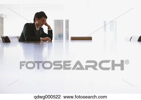 Stock Image - Tired Japanese businessman. Fotosearch
