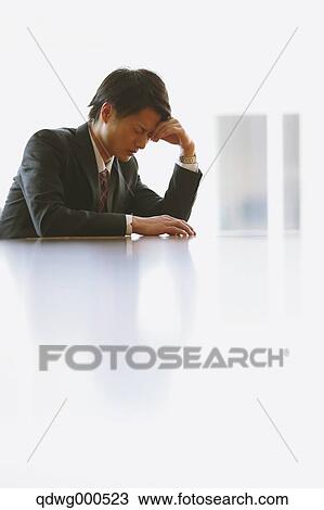 Tired Japanese businessman View Large Photo Image Stock Image - Tired Japanese businessman. Fotosearch