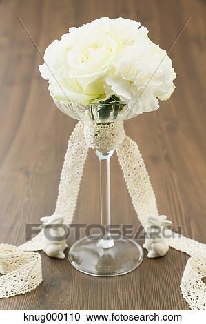 White roses in a glass View Large Photo Image Stock Image - White roses in a glass. Fotosearch