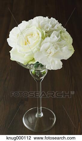 White roses in a glass View Large Photo Image Stock Image - White roses in a glass. Fotosearch