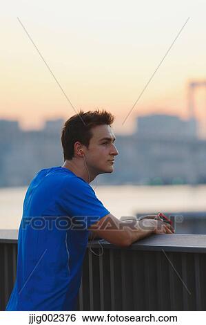 Young Caucasian man wearing sport clothes in metropolitan area View Large Photo Image Stock Photograph - Young Caucasian man wearing sport clothes in metropolitan area. Fotosearch
