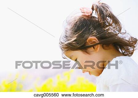 Young smiling Japanese girl enjoying cherry blossoms in a city park View Large Photo Image Stock Image - Young smiling Japanese girl enjoying cherry blossoms in a city park. Fotosearch