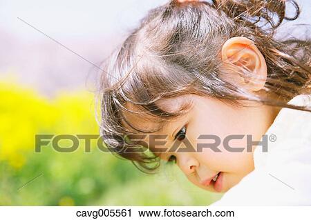Young smiling Japanese girl enjoying cherry blossoms in a city park View Large Photo Image Stock Image - Young smiling Japanese girl enjoying cherry blossoms in a city park. Fotosearch