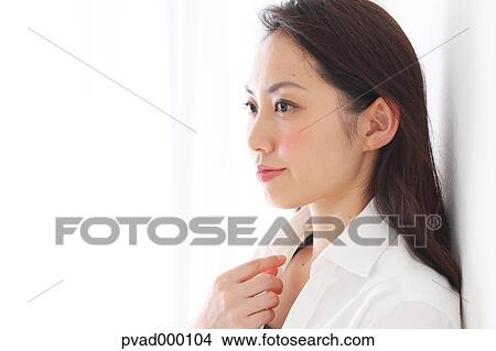 Attractive Japanese woman in a airy room View Large Photo Image Picture - Attractive Japanese woman in a airy room. Fotosearch