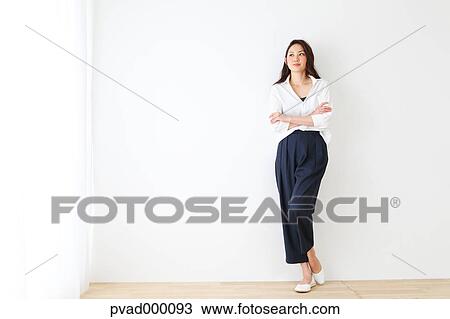 Attractive Japanese woman in a airy room View Large Photo Image Stock Image - Attractive Japanese woman in a airy room. Fotosearch