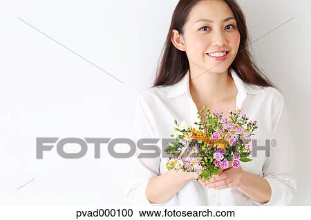 Attractive Japanese woman in a airy room View Large Photo Image Stock Image - Attractive Japanese woman in a airy room. Fotosearch