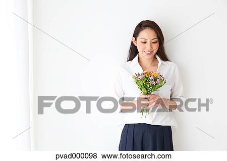Attractive Japanese woman in a airy room View Large Photo Image Stock Photo - Attractive Japanese woman in a airy room. Fotosearch