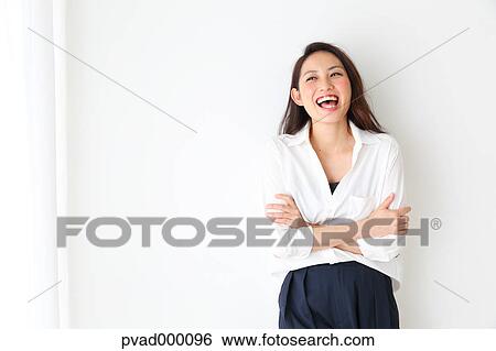 Attractive Japanese woman in a airy room View Large Photo Image Stock Photograph - Attractive Japanese woman in a airy room. Fotosearch