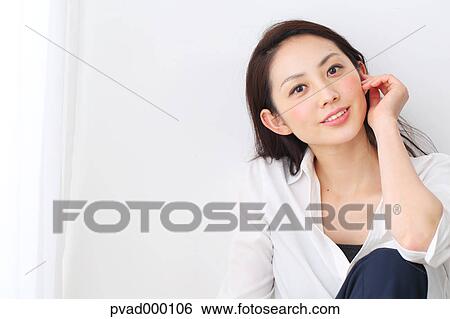 Attractive Japanese woman in a airy room View Large Photo Image Stock Photograph - Attractive Japanese woman in a airy room. Fotosearch