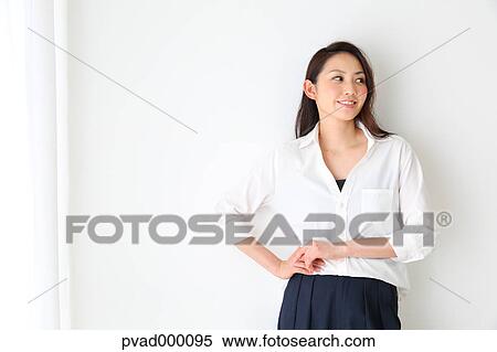 Attractive Japanese woman in a airy room View Large Photo Image Stock Photography - Attractive Japanese woman in a airy room. Fotosearch