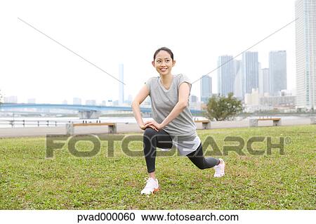 Attractive Japanese woman training by a river downtown Tokyo, Japan View Large Photo Image Stock Image - Attractive Japanese woman training by a river downtown Tokyo, Japan. Fotosearch