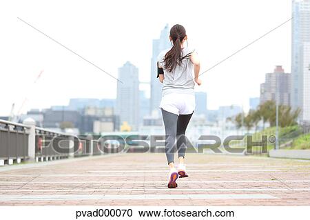 Attractive Japanese woman training by a river downtown Tokyo, Japan View Large Photo Image Stock Image - Attractive Japanese woman training by a river downtown Tokyo, Japan. Fotosearch