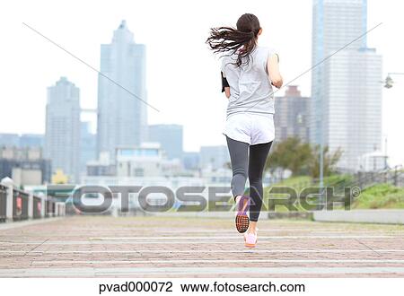 Attractive Japanese woman training by a river downtown Tokyo, Japan View Large Photo Image Stock Image - Attractive Japanese woman training by a river downtown Tokyo, Japan. Fotosearch