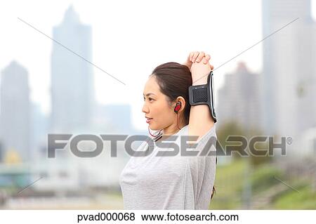 Attractive Japanese woman training by a river downtown Tokyo, Japan View Large Photo Image Stock Photo - Attractive Japanese woman training by a river downtown Tokyo, Japan. Fotosearch