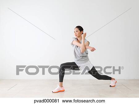 Attractive Japanese woman training in a airy room View Large Photo Image Stock Image - Attractive Japanese woman training in a airy room. Fotosearch