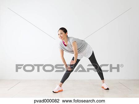 Attractive Japanese woman training in a airy room View Large Photo Image Stock Image - Attractive Japanese woman training in a airy room. Fotosearch