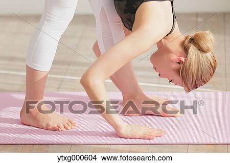 Attractive young Japanese practicing yoga in an airy room View Large Photo Image Picture - Attractive young Japanese practicing yoga in an airy room. Fotosearch