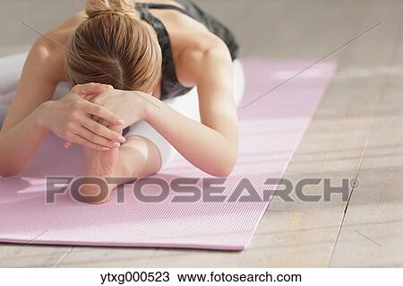 Attractive young Japanese practicing yoga in an airy room View Large Photo Image Stock Image - Attractive young Japanese practicing yoga in an airy room. Fotosearch