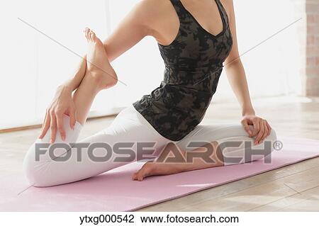 Attractive young Japanese practicing yoga in an airy room View Large Photo Image Stock Image - Attractive young Japanese practicing yoga in an airy room. Fotosearch