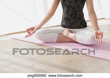 Attractive young Japanese practicing yoga in an airy room View Large Photo Image Stock Image - Attractive young Japanese practicing yoga in an airy room. Fotosearch
