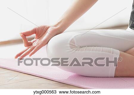 Attractive young Japanese practicing yoga in an airy room View Large Photo Image Stock Image - Attractive young Japanese practicing yoga in an airy room. Fotosearch