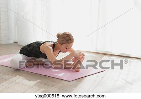 Attractive young Japanese practicing yoga in an airy room View Large Photo Image Stock Photography - Attractive young Japanese practicing yoga in an airy room. Fotosearch