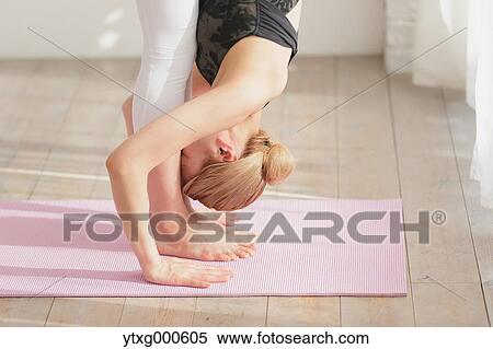 Attractive young Japanese practicing yoga in an airy room View Large Photo Image Stock Photography - Attractive young Japanese practicing yoga in an airy room. Fotosearch