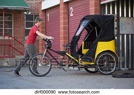 Bicycle taxi driver fixing his vehicle, Salt Like City, USA View Large Photo Image Stock Image - Bicycle taxi driver fixing his vehicle, Salt Like City, USA. Fotosearch